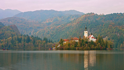 Fototapeta na wymiar Picturesque view of the island on Lake Bled and Bled castle. Autumn. Slovenia, Europe.