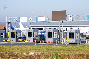 Payment point for entering the airport, cars are parked in front of the barrier at the entrance to the airport. Paid Parking at the airport. Entrance to the toll road