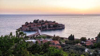 Naklejka premium Aerial panoramic view of the island of St. Stephen (Sveti Stefan) at sunset. Montenegro.