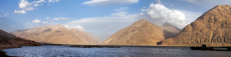 Fototapeta na wymiar Panj river and Hindukush mountains panoramic view