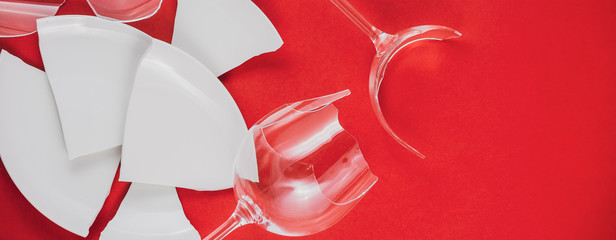 Broken Plate or broken water glass on the on the red background The concept of accidents in the...