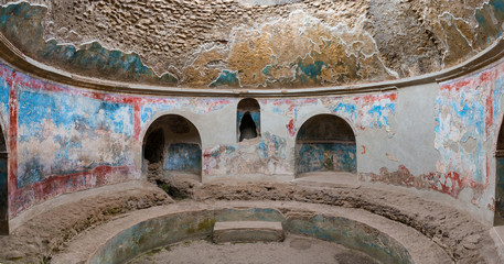 Large cold pool at the antique Roman baths, called frigidarium in the city of Pompeii, destroyed by...