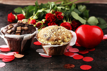 chocolate muffins, blueberry muffin and nut muffins on dark background for Valentine's day. tinting. selective focus