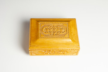 Closed single casket isolated on white with soft shadows, wooden box, wooden chest, treasure chest.
