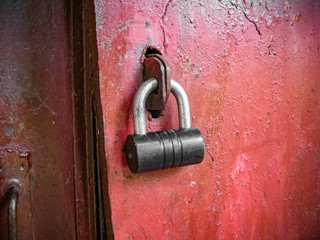 Iron door locked with padlock