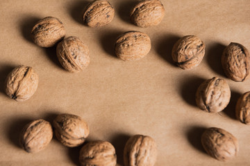 walnuts in the shell on wooden background