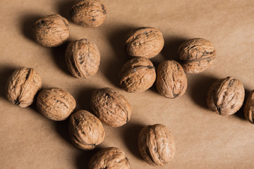 walnuts in the shell on wooden background