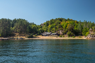 Beautiful summer house in a small bay with a sand beach.