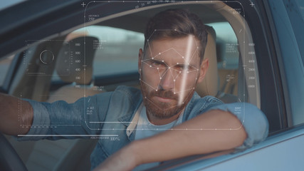 Future. Face Detection. Technological 3d Scanning. Biometric Facial Recognition. Face Id. Technological Scanning of the Face of Handsome Caucasian Man In The Car for Facial Recognition. Shoted by Arri
