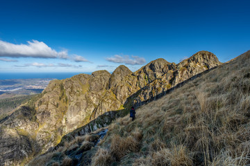 A young woman descending the mountain of Peñas de Aia, Guipuzkoa. Basque Country