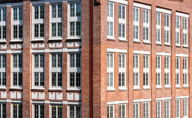 Obraz premium Large office building in brick with huge white windows.