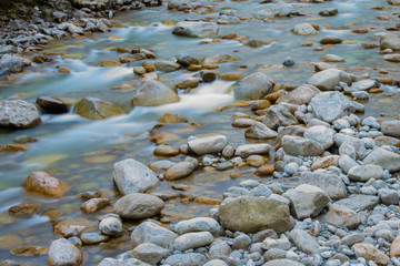 river flows among stones timelapse