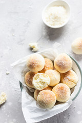 Sweet coconut cookies on a white plate, light grey concrete background. Coconut macaroon.