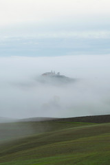 Foggy morning hills in Tuscany, Italy, Europe