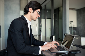 Businessman works at home with a laptop. concept of internet sharing.