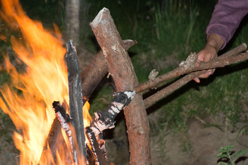 night bonfire trunks burning in the fire