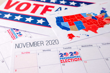 Fototapeta na wymiar November 2020 presidential election text on calendar concept. To illustrate voting and political campaign in the united states of america this year. Red white and blue colors and the american flag.