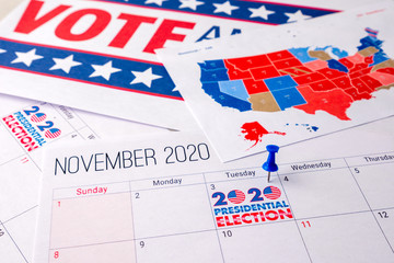 Obraz premium November 2020 presidential election text on calendar concept. To illustrate voting and political campaign in the united states of america this year. Red white and blue colors and the american flag.