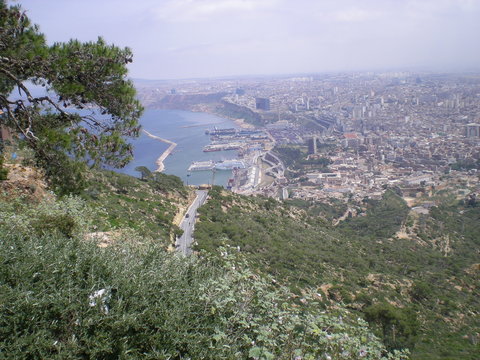 Wonderful view from the top of a hill, bay, harbor, city, blue sky and sun, from Santa Cruz, oran in Algeria