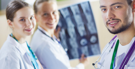 Group of doctors and nurses looking at X-ray