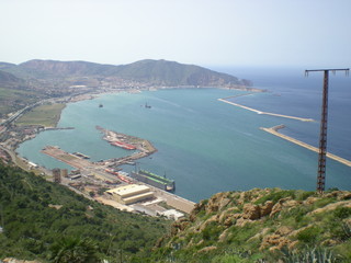 Obraz premium Wonderful view from the top of a hill, bay, harbor, city, blue sky and sun, Algeria, Africa