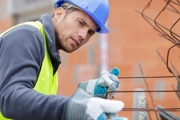 builders on a metal structure