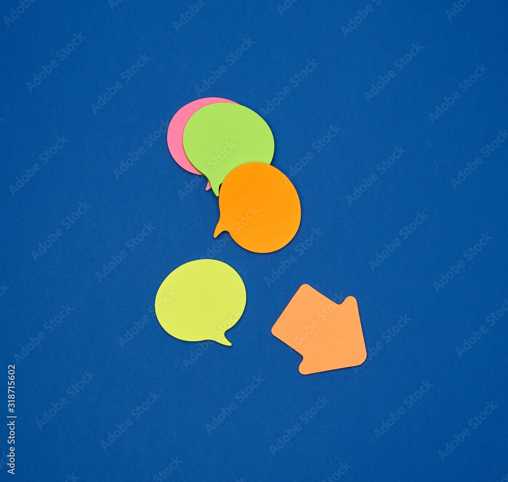 Poster multicolored empty paper stickers in the form of clouds on a blue background