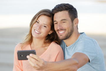 couple in love taking selfies outdoors