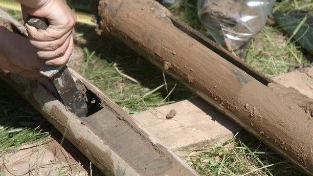 Geologist taking core samples out from drilling pipe for geological survey