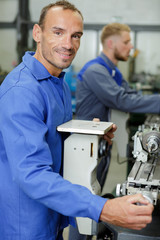 a mechanic man cutting aluminium