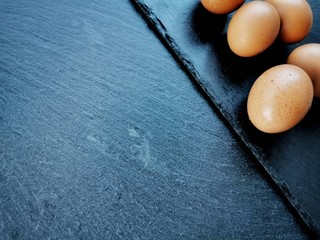 Eggs against a dark background. Copy space. Concept of Easter.