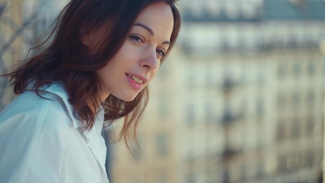 Beautiful girl on the balcony in France