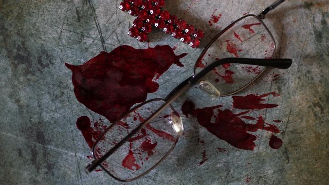 Close up of cross of jesus on bloody grunge background