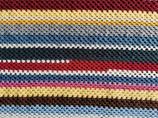 Home made colored crochet blanket.  Strips Backgrounds.