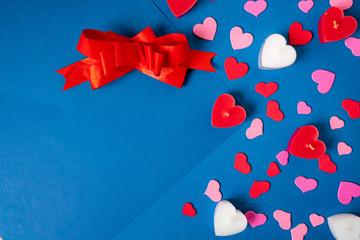 Valentine`s Day holiday frame made of red and white hearts on blue background. Romantic greeting card mockup. Love concept.