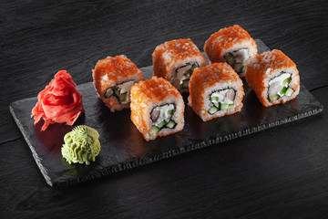 sushi roll on a slate board