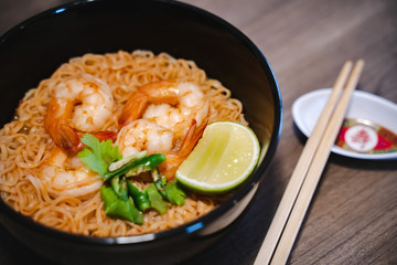 Spicy instant thai style noodles soup with shrimp (tom yum kung) 