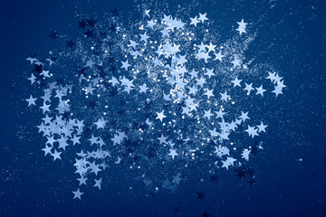 Sparkling background with bokeh made of Classic Blue color.
