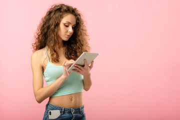 Closeup studio portrait of pretty girl with tablet