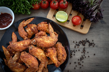 Hot Meat Dishes - Fried Chicken Wings on plate with salad