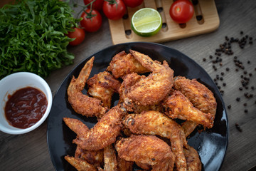 Hot Meat Dishes - Fried Chicken Wings on plate with salad