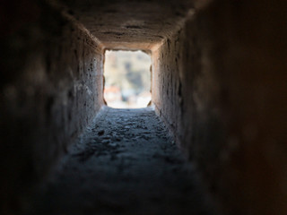 Look through the inside of rectangle brick hole in different perspective and affinities , sunlight...