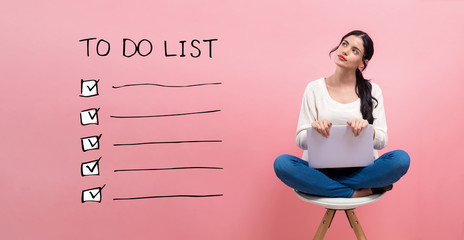 To do list with young woman using a laptop computer