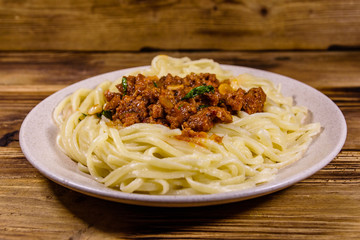 Pasta with bolognese sauce in a ceramic plate