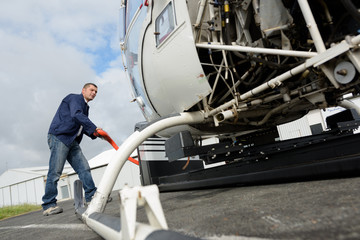 a helicopter lifting the equipment