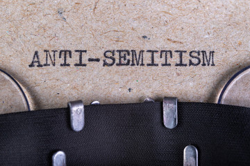 The word anti-semitism written in typewriter font. The inscription in the old style on gray paper.