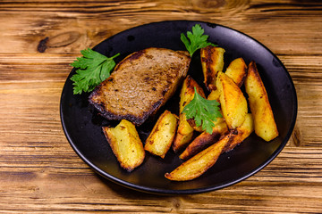 Roasted beefsteak with the fried potato and parsley