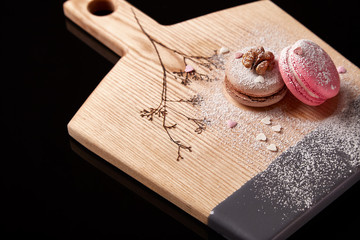 Exclusive painted art cutting board made of wood organic serving dishes with taste food cuisine coffee break milk cream macarons cappuccino drink sweet desert.