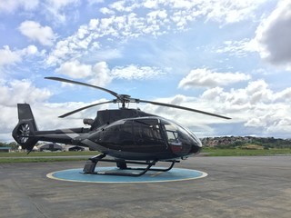 Large executive helicopter parked at airport awaiting businessman © CmteZero