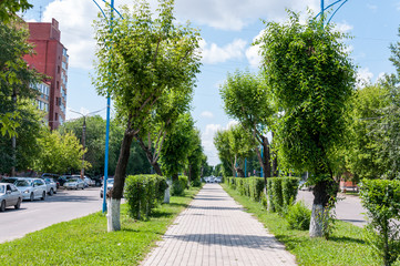 Naklejka premium Russia, Blagoveshchensk, July 2019: Alley among the highways in the city of Blagoveshchensk in the summer